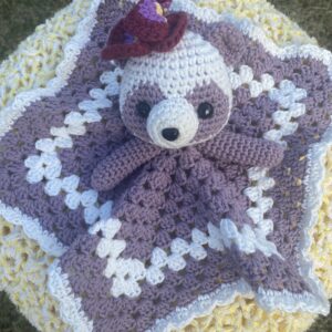 Pansy Panda handmade crochet lovey with lavender and white blanket and purple flower